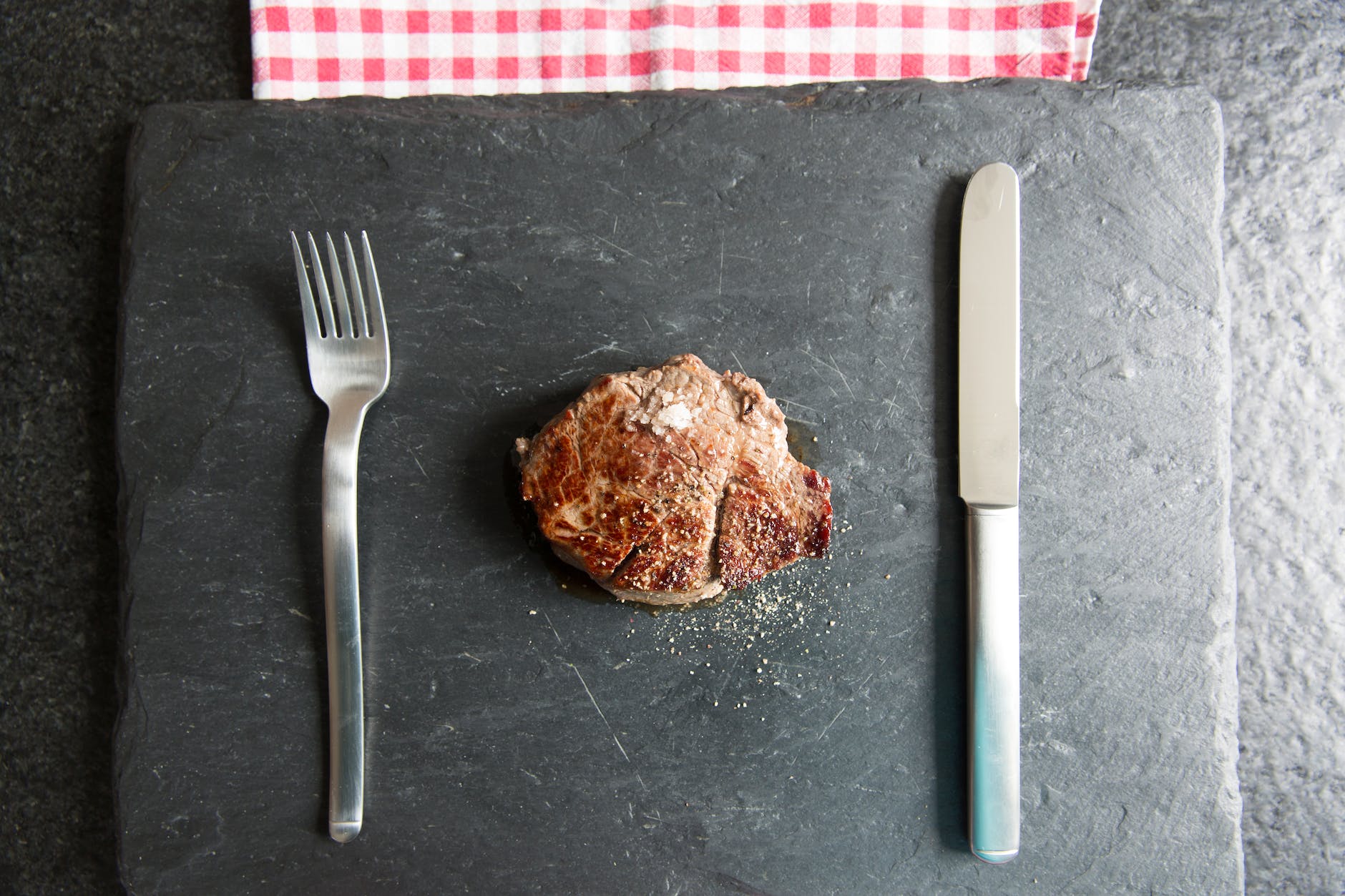 white handled fork beside brown bread